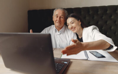 two business partners working with laptop cafe